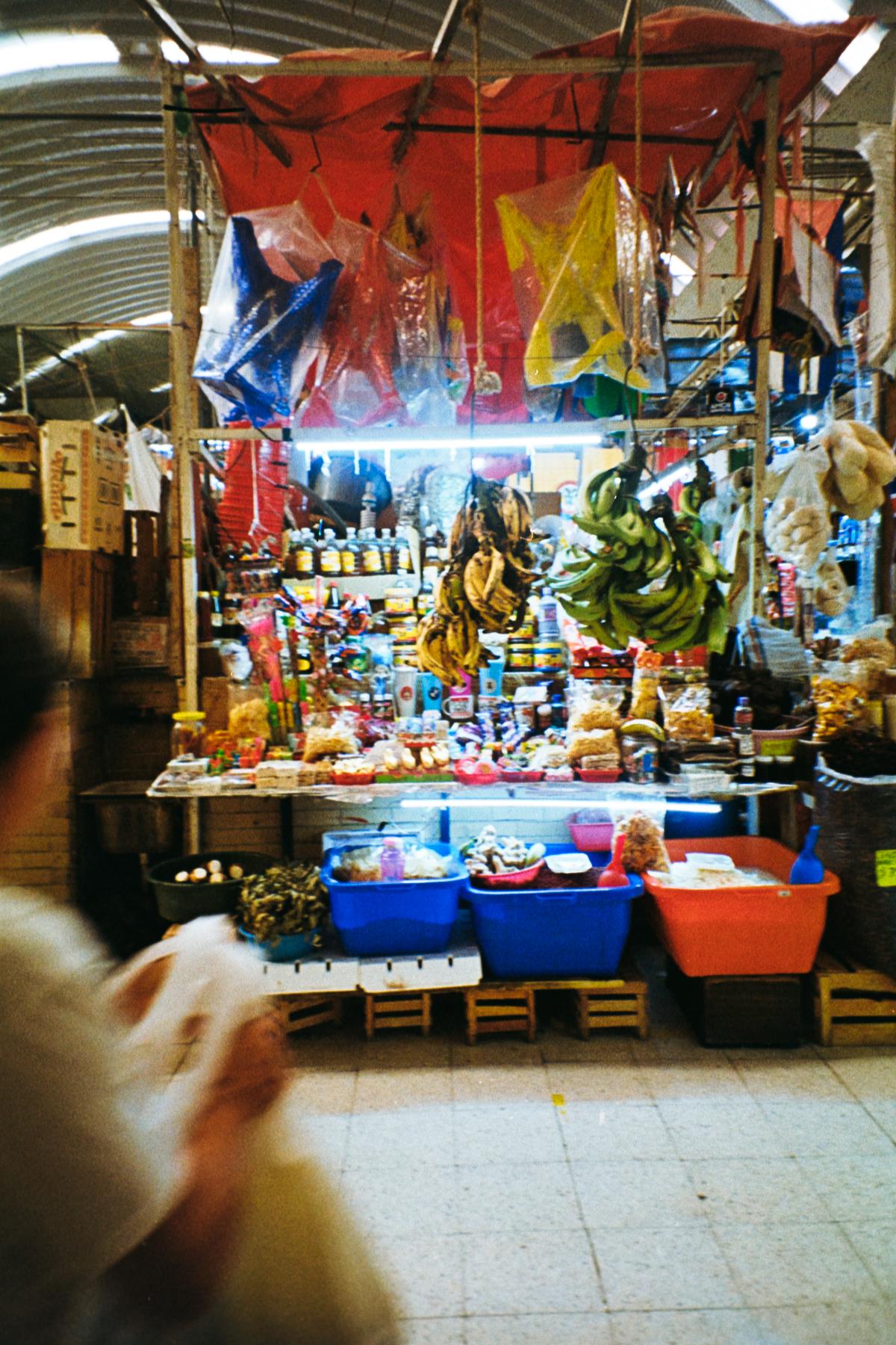 analog street photograph of a food market stand in Mexico City